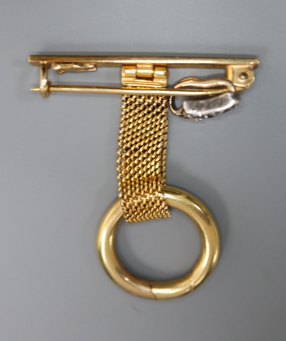 A 9ct gold lapel watch suspension and a three-stone graduated diamond set suspension, gross 7 grams.